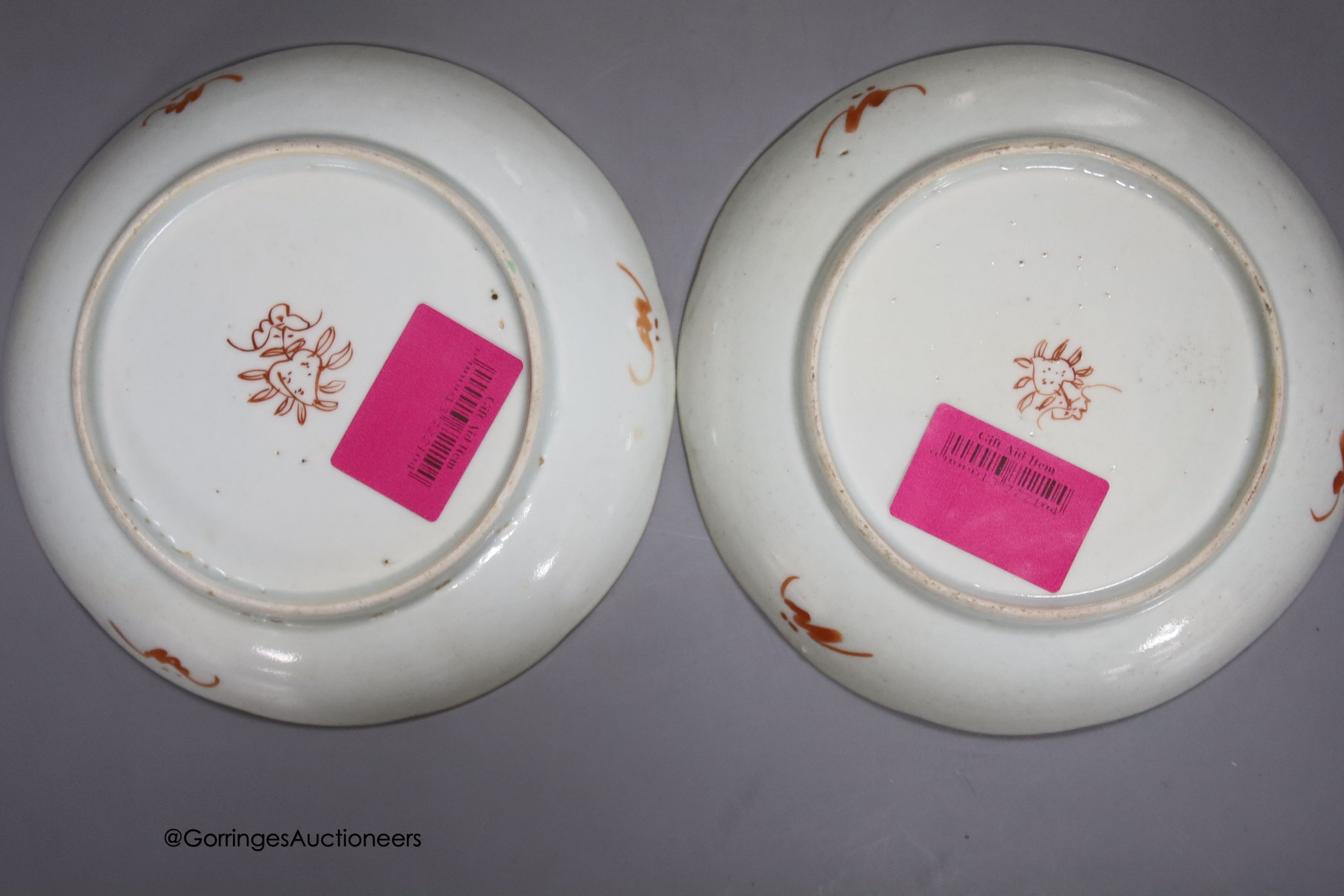 A 19th century Chinese famille rose bowl, two saucers and two 18th century Chinese famille rose plates 23cm